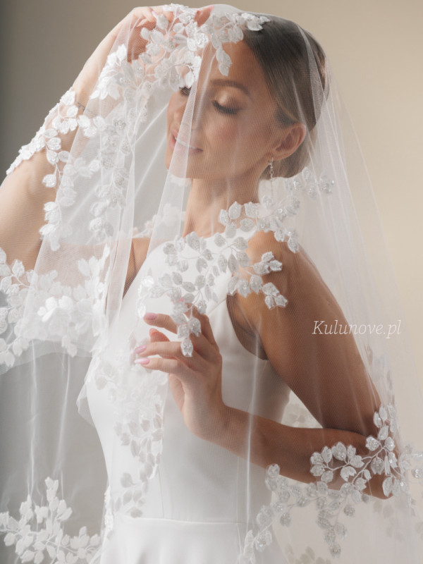 Cathedral wedding veil decorated with subtle floral appliqués