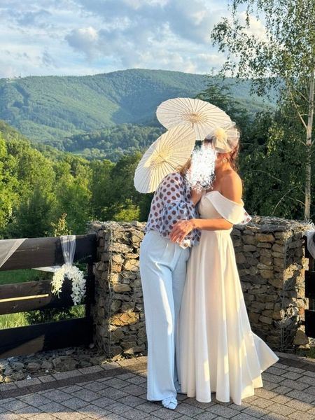 Angelina maxi - ecru colored wedding dress sewn on a wide circle with bare shoulders