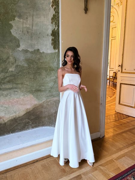 Hannah A380 - an ecru wedding dress with a classic corset, a simple neckline, and a flared skirt