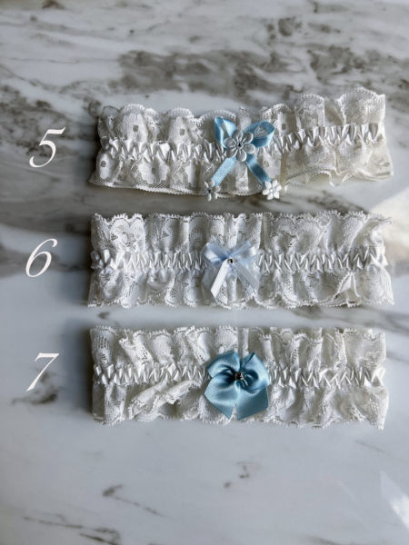 White lace bridal garter with blue accents
