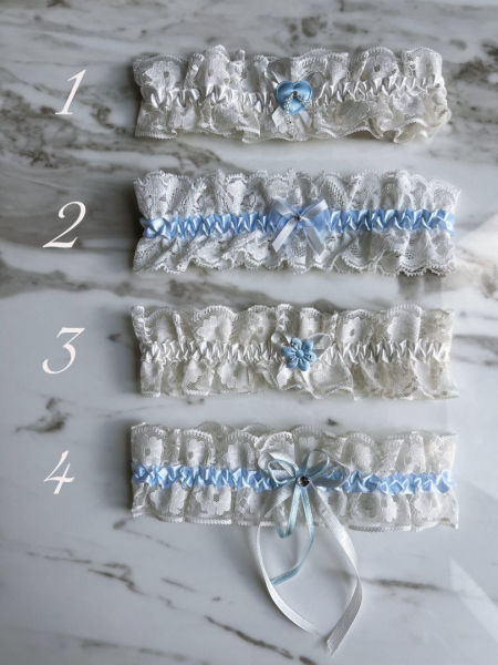 White lace bridal garter with blue accents