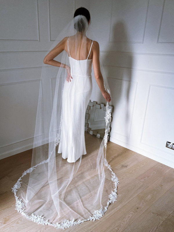 Long cathedral veil trimmed with floral lace