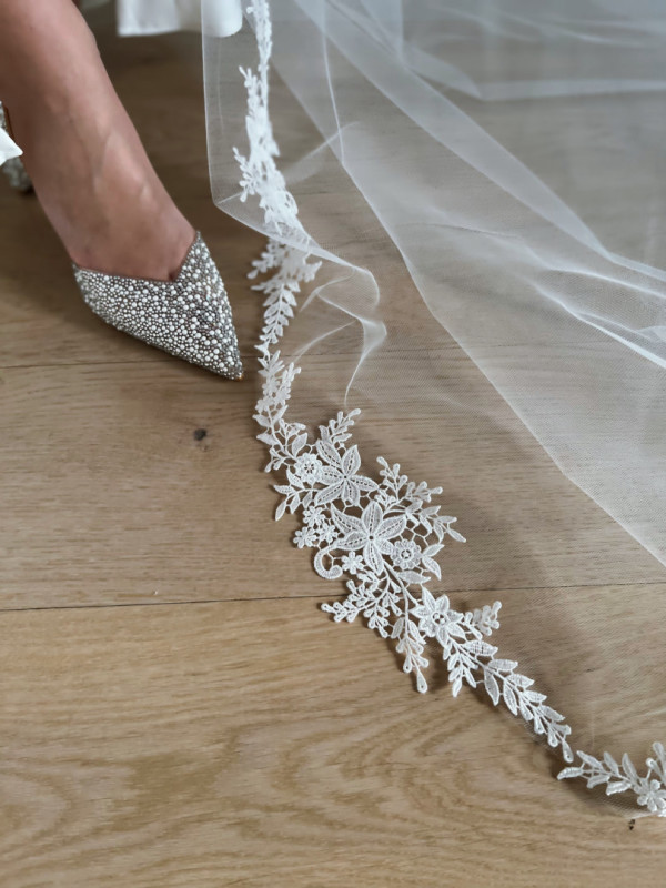 Long cathedral veil trimmed with floral lace