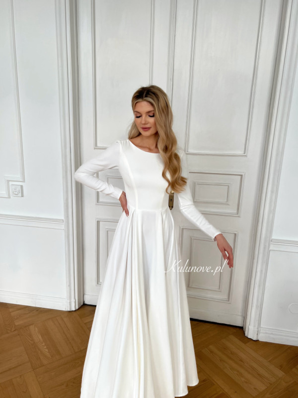 Genevieve - minimalist ecru wedding dress on wide circle with long sleeve back neckline