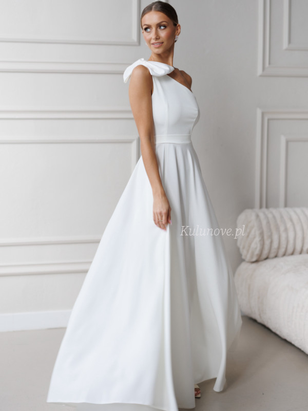 Helen - a striking one-shoulder wedding dress with a bow and a simple bottom.