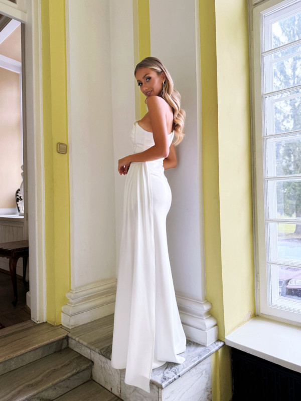 Melanie - a fitted one-shoulder wedding dress with a ruffled neckline and decorative crystals with fine lines