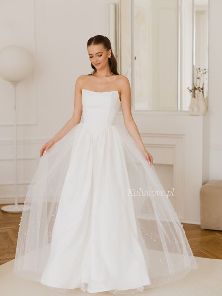 Rebekah - tulle wedding dress with pearls in ecru color with a striking neckline