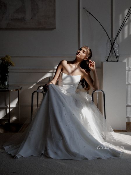 Rebekah - tulle wedding dress with pearls in ecru color with a striking neckline