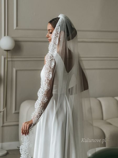 Cathedral wedding veil decorated with French lace