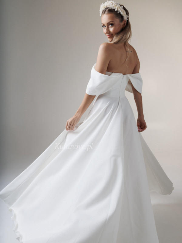 Abby - long ecru wedding dress with Spanish style neckline with leg slit