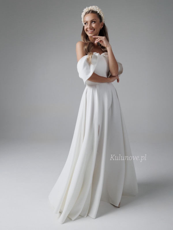 Abby - long ecru wedding dress with Spanish style neckline with leg slit