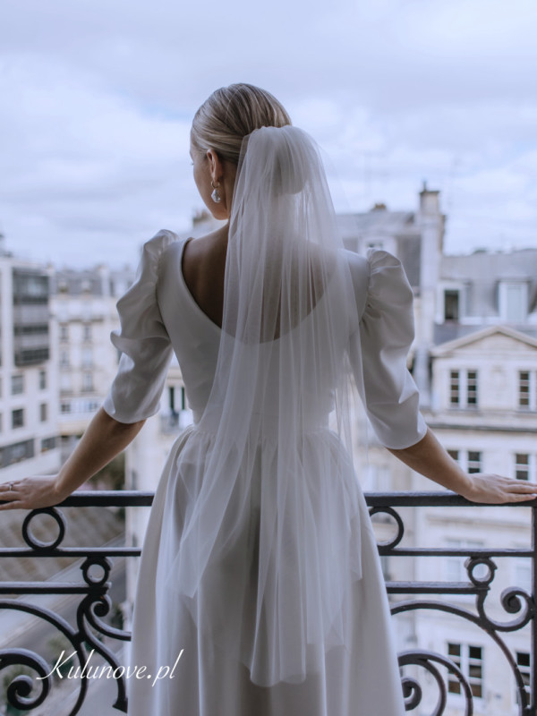 Short snow-white wedding veil without decorations
