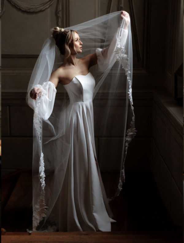 Cathedral wedding veil decorated with lace