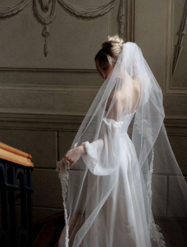 Cathedral wedding veil decorated with lace
