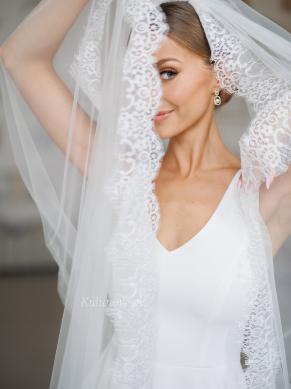 Cathedral wedding veil decorated with French lace