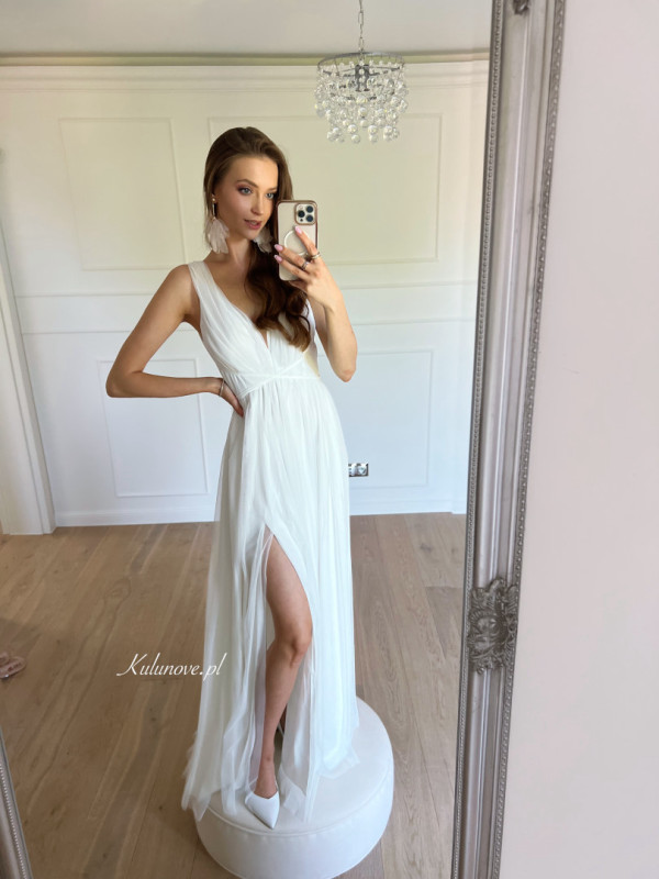 Zendaya - long ethereal ecru wedding dress with thicker straps tied at the waist